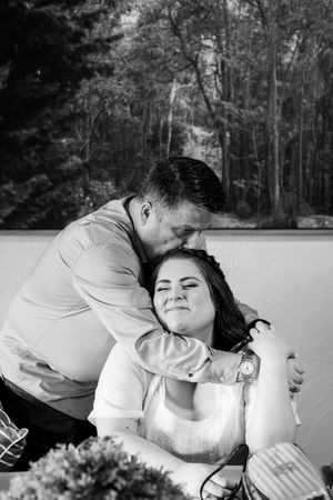 Black and white wedding photos father of the bride kissing daughter on the head
