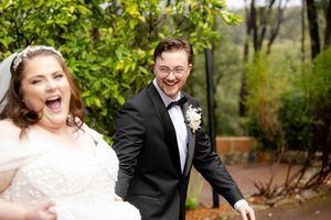 Candid outdoor wedding portraits with natural greenery and joyful expressions.