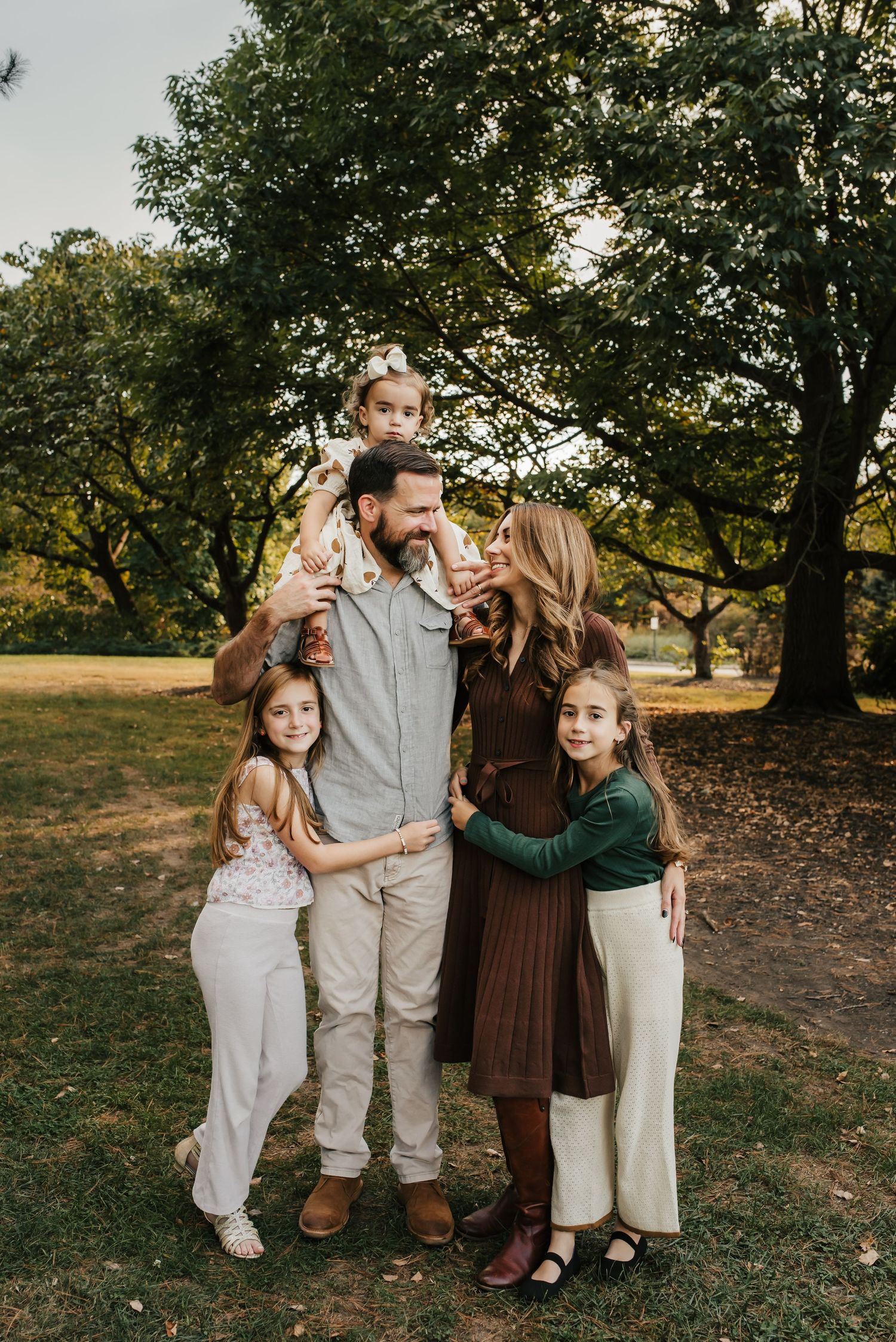 Family hugging and smiling for a candid mini session photo