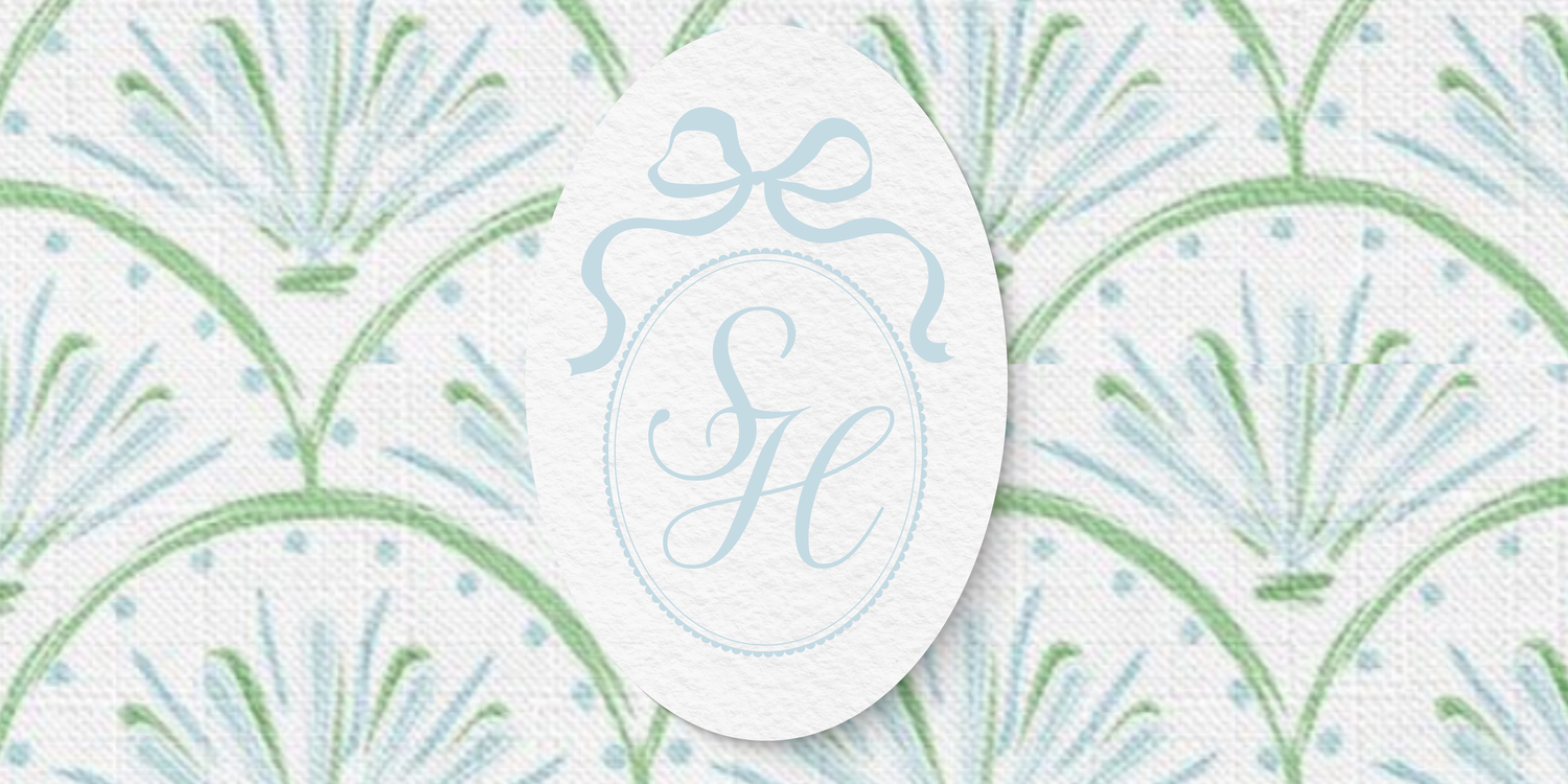 Delicate green and blue floral damask pattern with scrolling vines and leaves on a light background.
