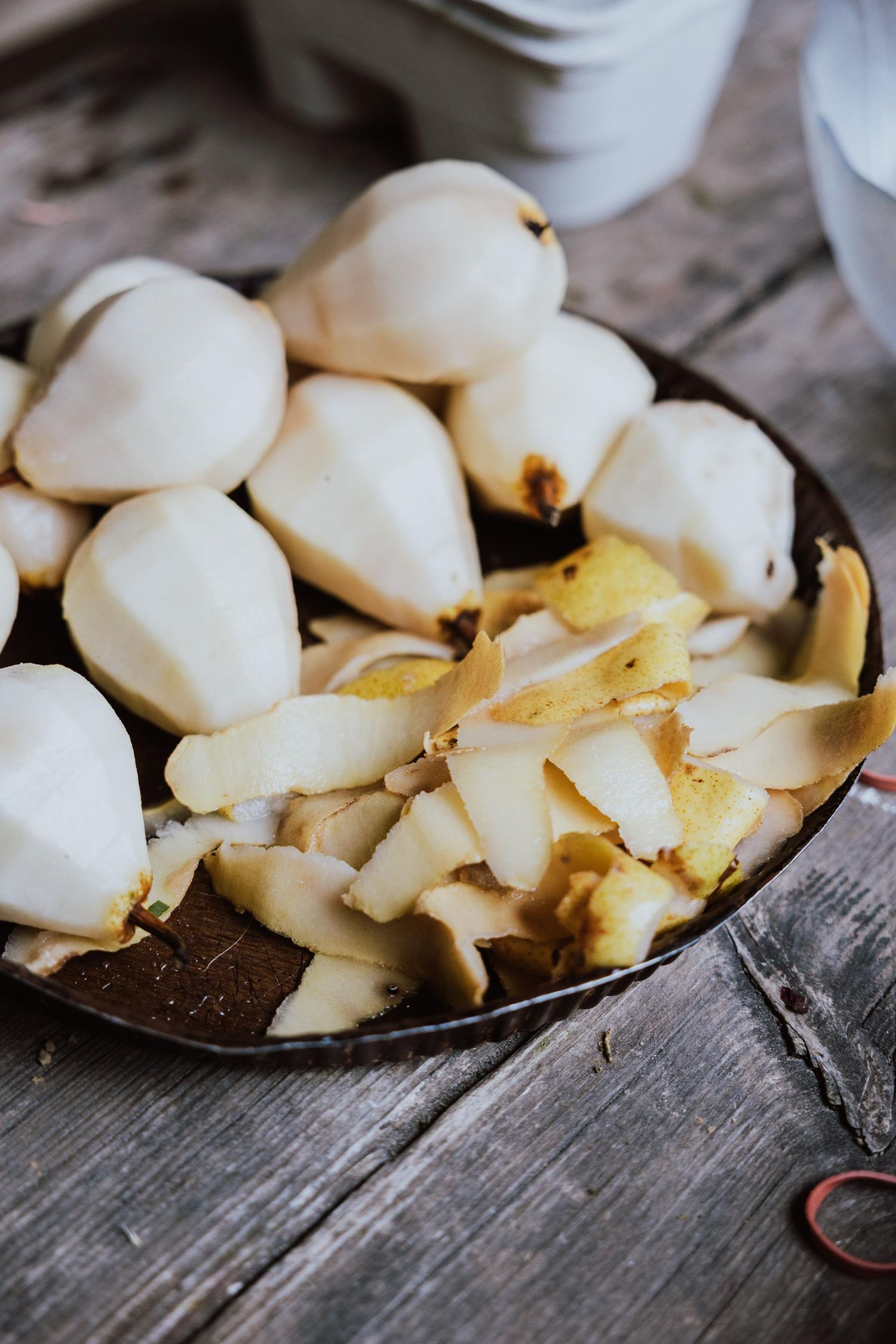 Fresh sliced white pears arranged on a rustic wooden surface.