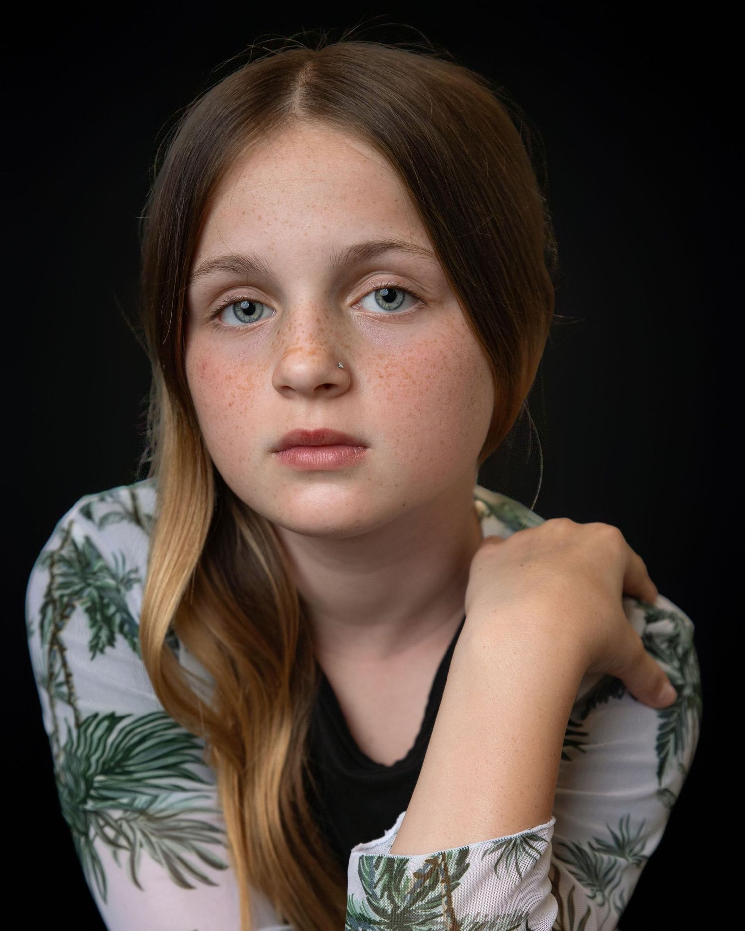 Portrait series showing different angles of someone with ombre hair wearing a light blue collared shirt.