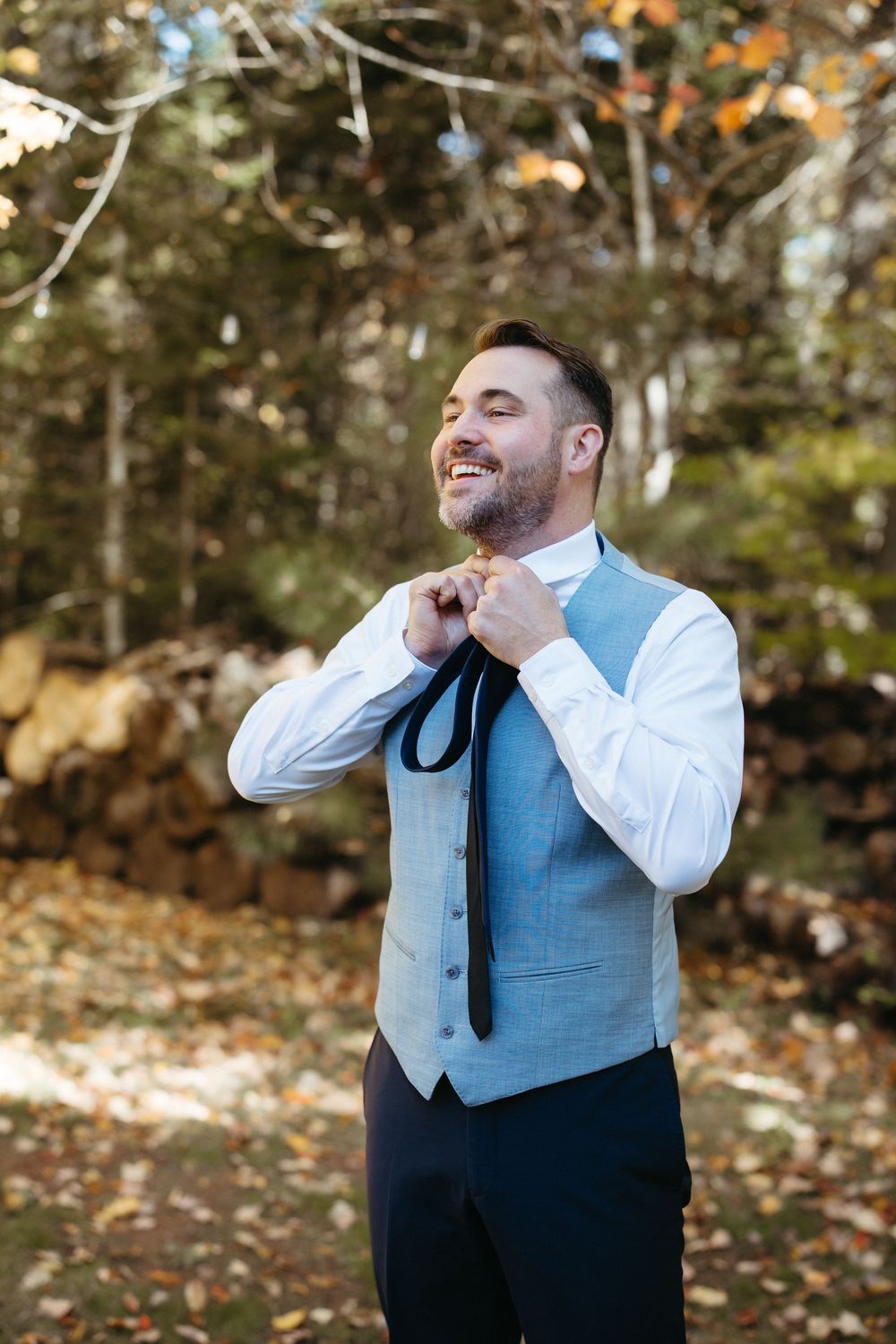 Groom getting ready portraits outside in an outdoor fall wedding, October tent wedding in Moncton New Brunswick, true to colour photography