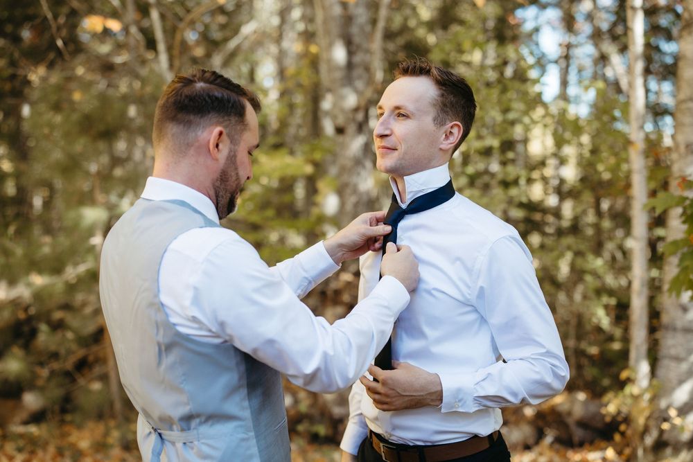 Grooms getting ready backyard wedding photography in Dieppe New Brunswick, candid documentary style wedding photography storytelling