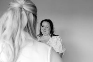 Black and white artistic photo series showing emotional expressions and movements against a light background.