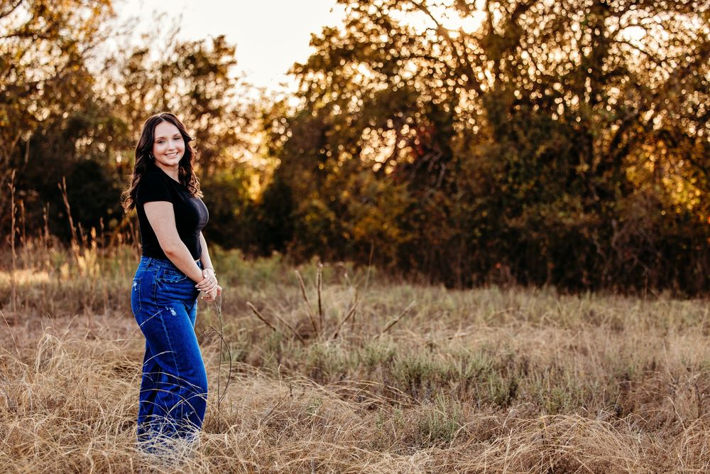 Multiple photos of a woman in casual attire walking through a sunlit meadow at golden hour.