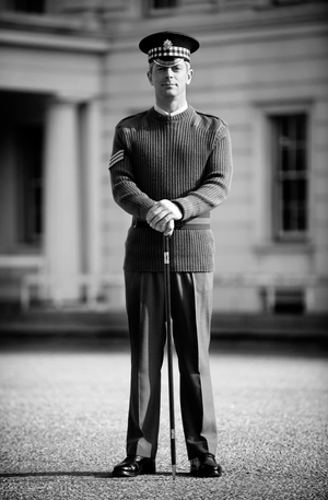 A Scots guards SNCO posing on the parade square at Wellington Barracks, London.