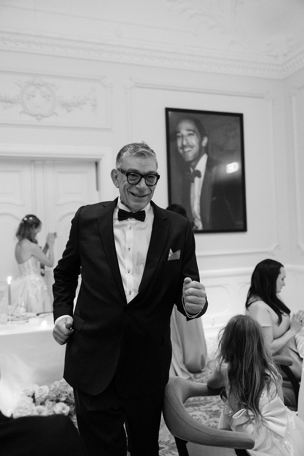 Black and white photo sequence showing guests dancing and celebrating at an elegant indoor wedding reception.