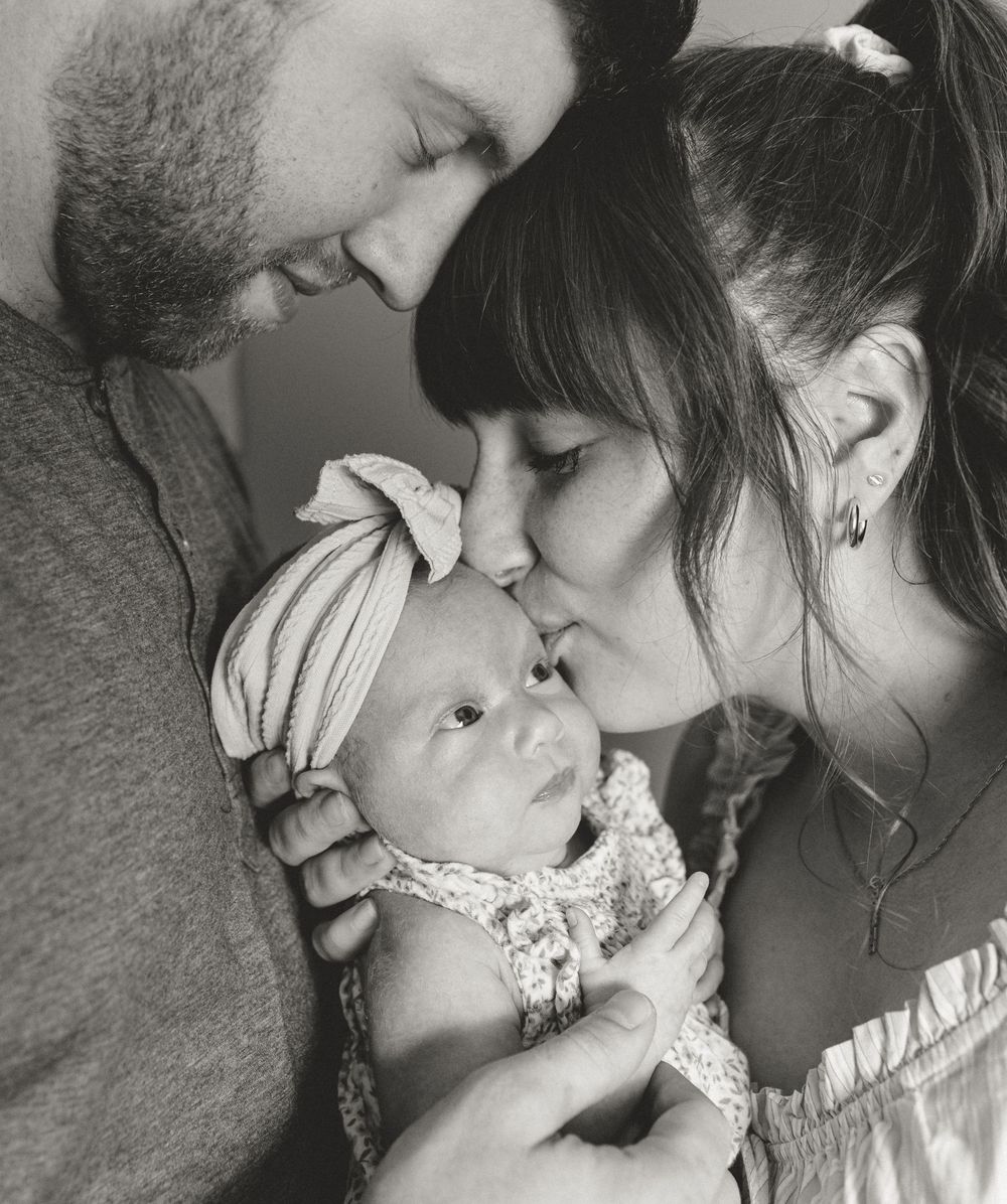A series of black and white romantic photographs showing tender moments of affection and closeness.