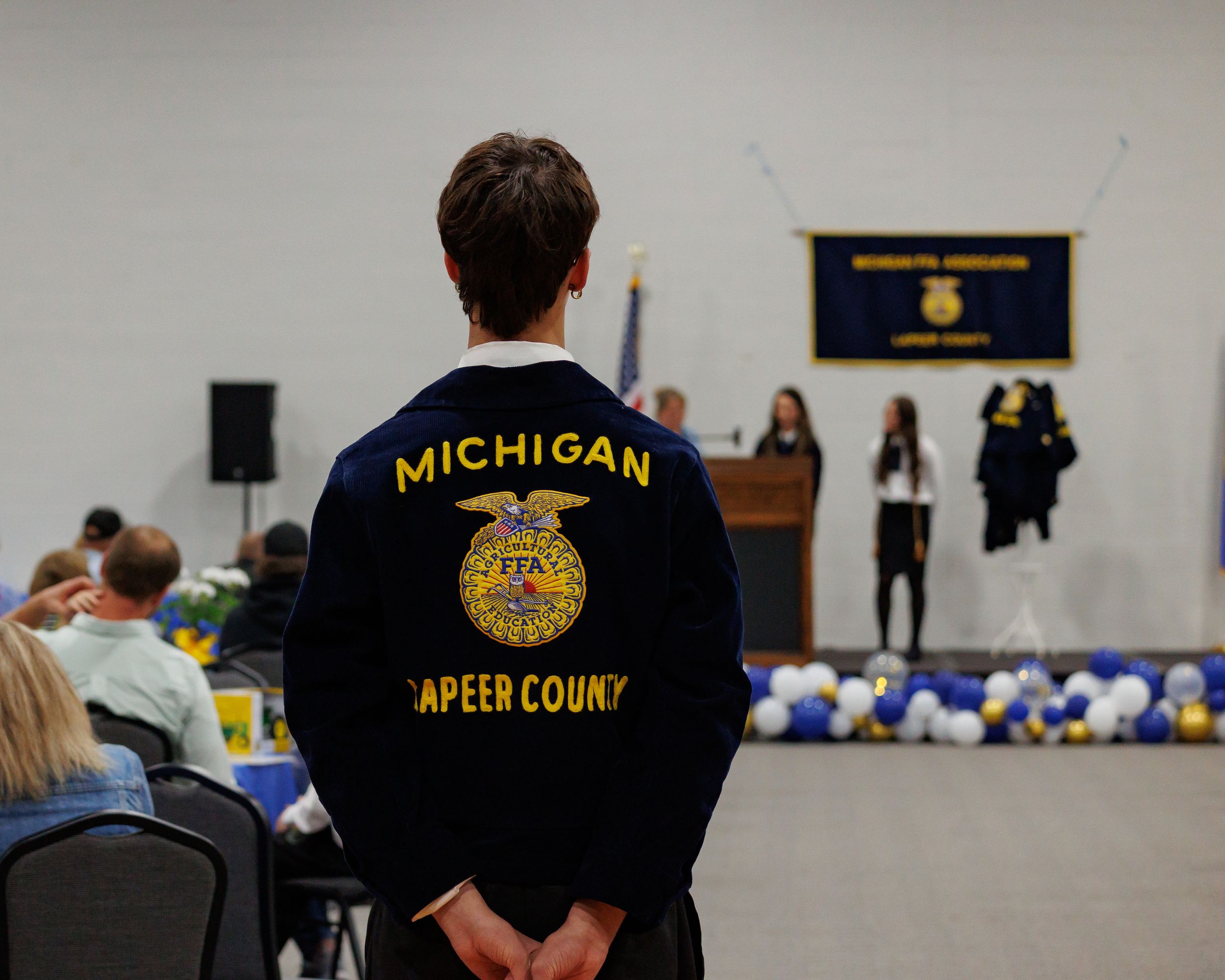 Michigan Appellate Court judge presides over court proceedings while wearing black robes.