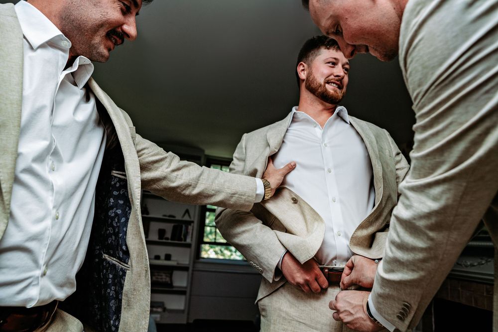 A series of four candid wedding photos showing intimate moments between a couple in formal attire.