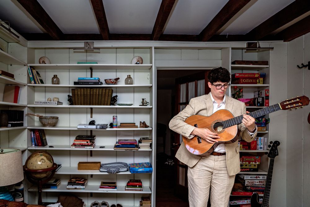 A series of images showing someone playing an acoustic guitar in a room with wooden beams and shelves.