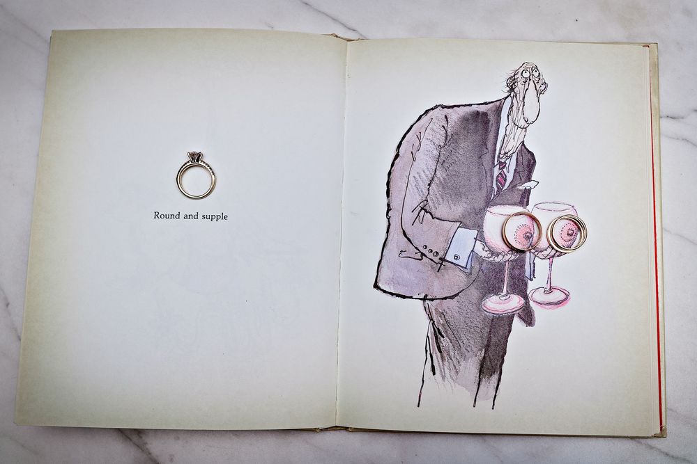A series of minimalist ink drawings showing a person holding and examining a ring in different poses.