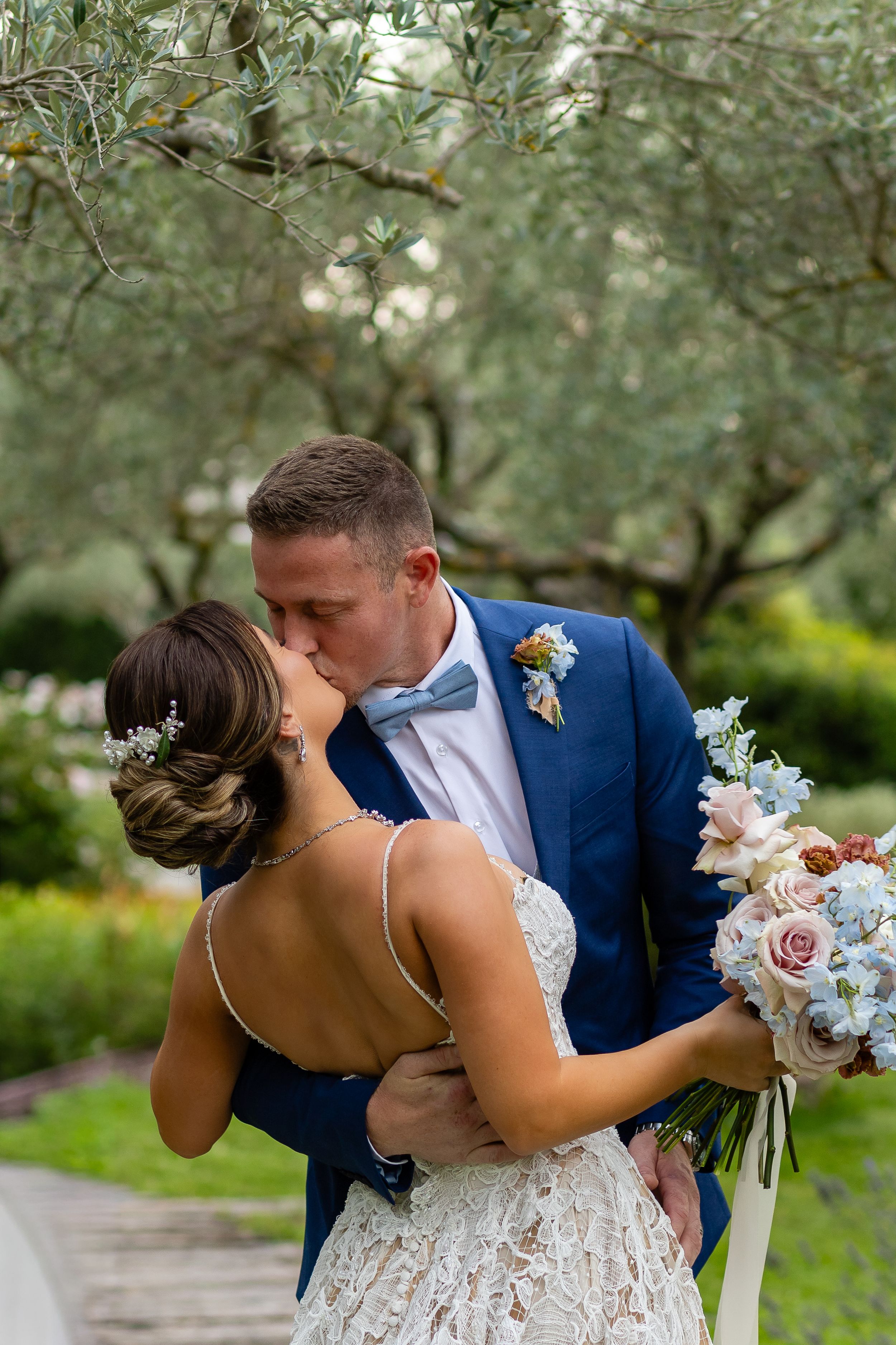 Bride and groom sharing a romantic moment during their Assisi vow renewal ceremony.