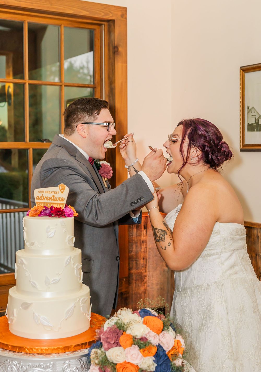 Wedding cake cutting sequence showing couple feeding each other cake at their reception.