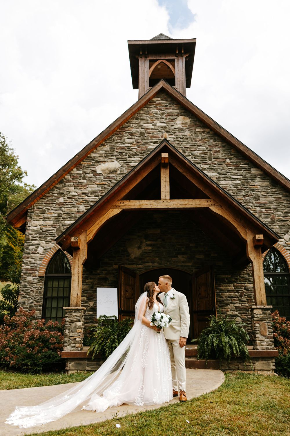 A rustic stone chapel with wooden beams is shown in a progressive series of wedding photos on a hillside.