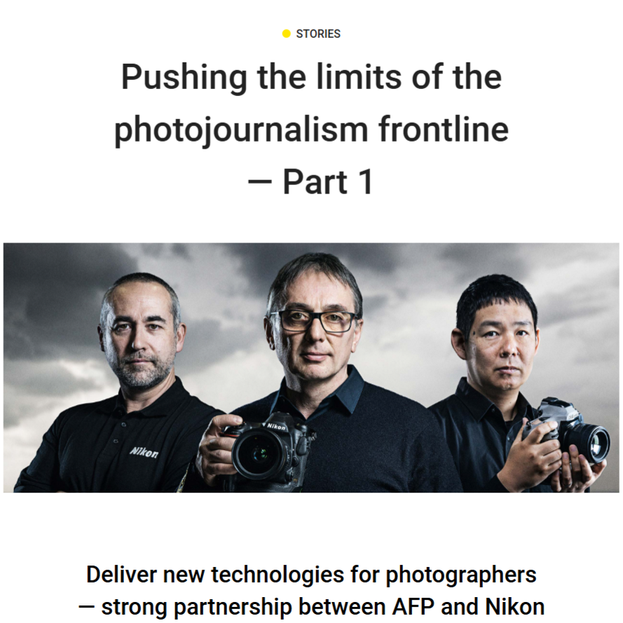Group of professional photographers with cameras standing together showcasing photojournalism equipment and technology.