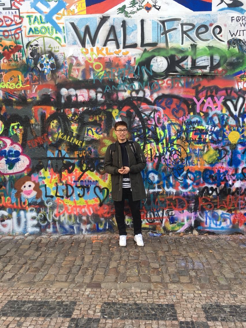 Colorful graffiti art covers the John Lennon Wall in Prague, with vibrant street art and messages of peace and freedom.