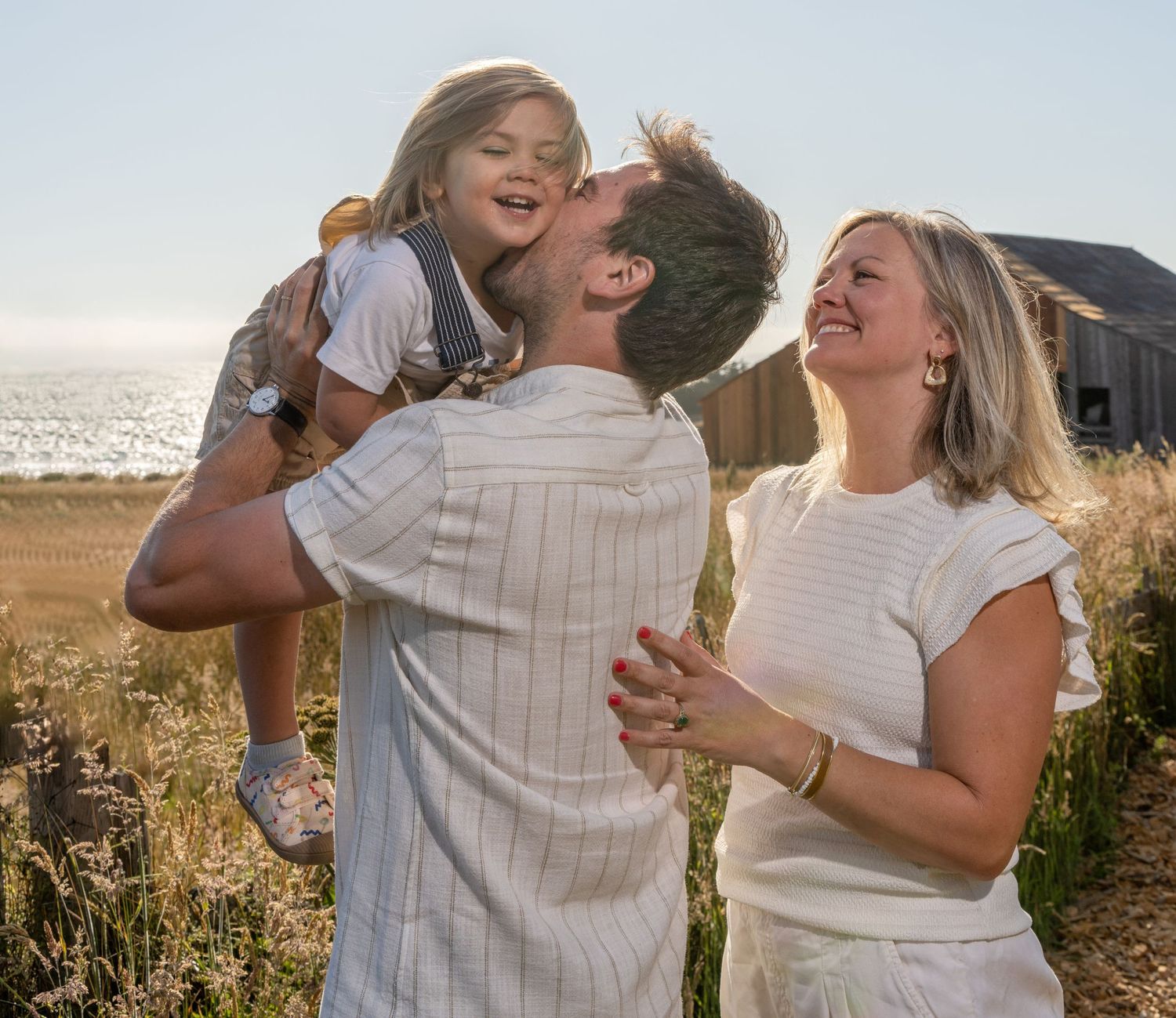 A romantic series of photos showing an affectionate couple embracing and laughing together in a sunlit outdoor setting.