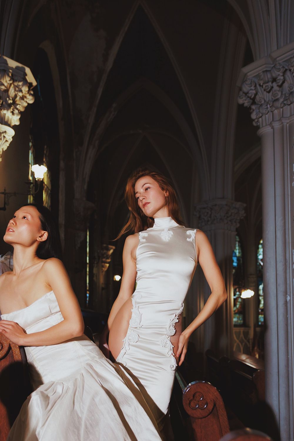 Multiple sequential shots of movement in a white dress against gothic church architecture and columns.