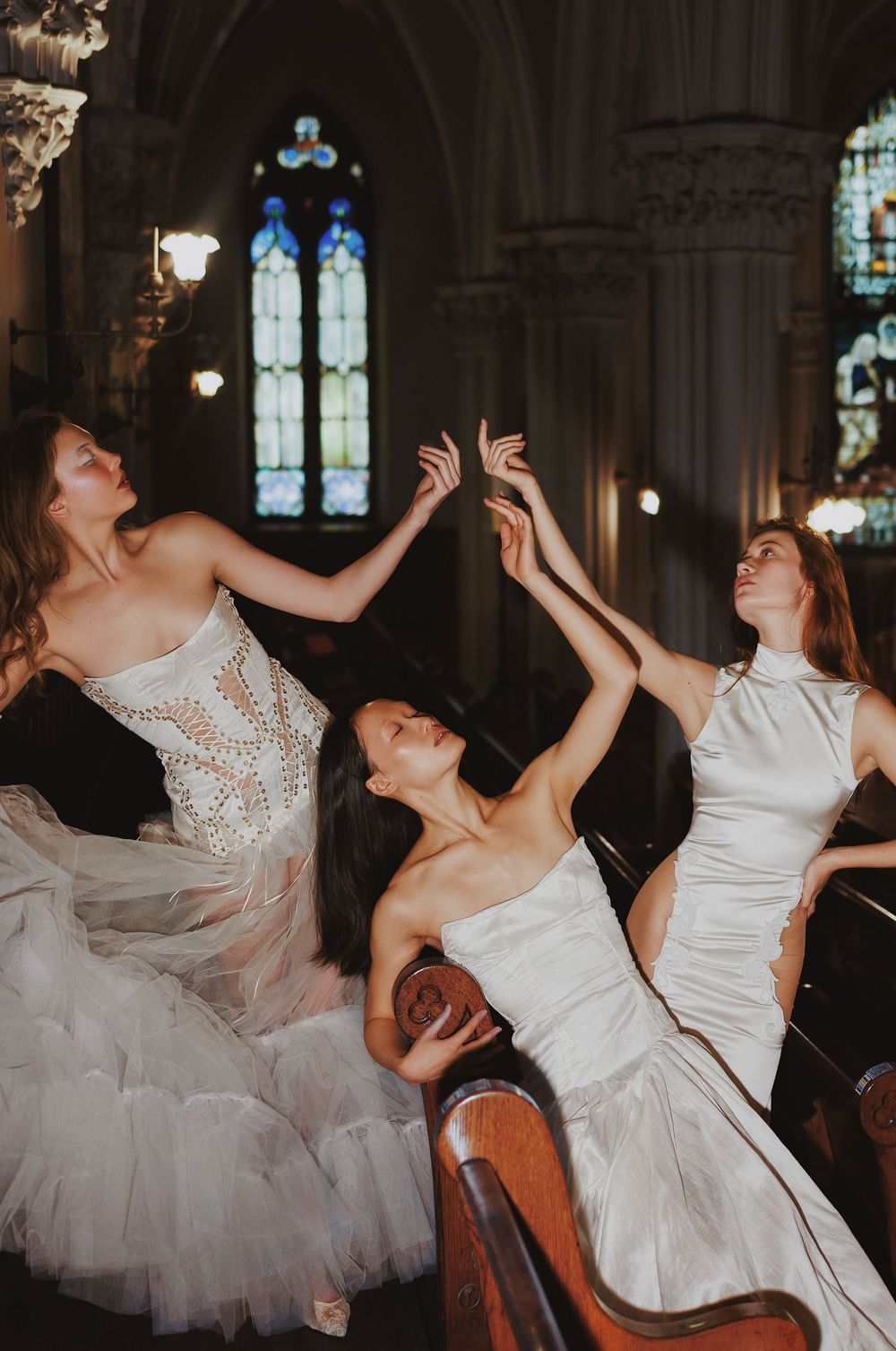 A ballet-inspired photo sequence showing graceful dance movements in a gothic church setting with stained glass windows.