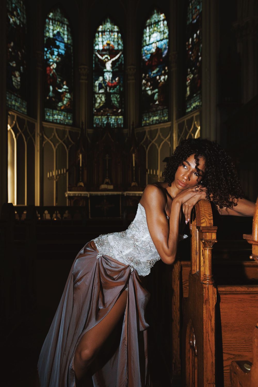 Artistic dance sequence showing flowing movements in a dimly lit church with wooden pews.