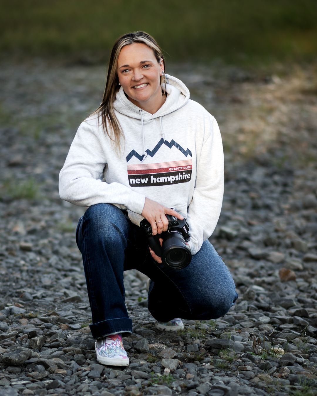Wandering Roots Collective photographer Nicole Rogers in natural outdoor setting.