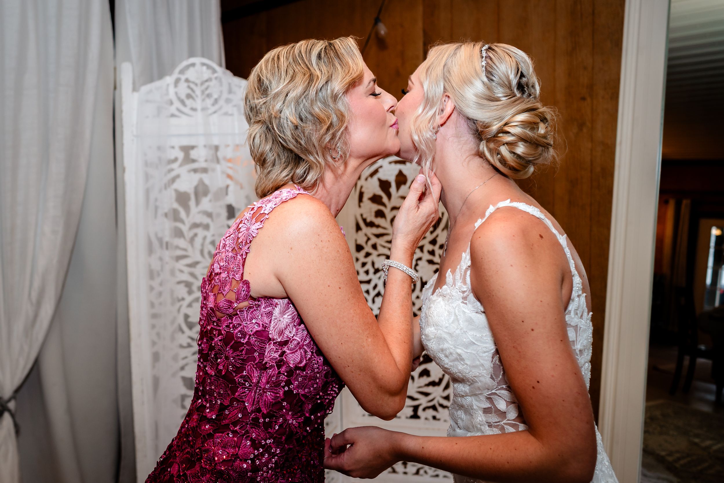An emotional moment shared between two people in formal attire.
