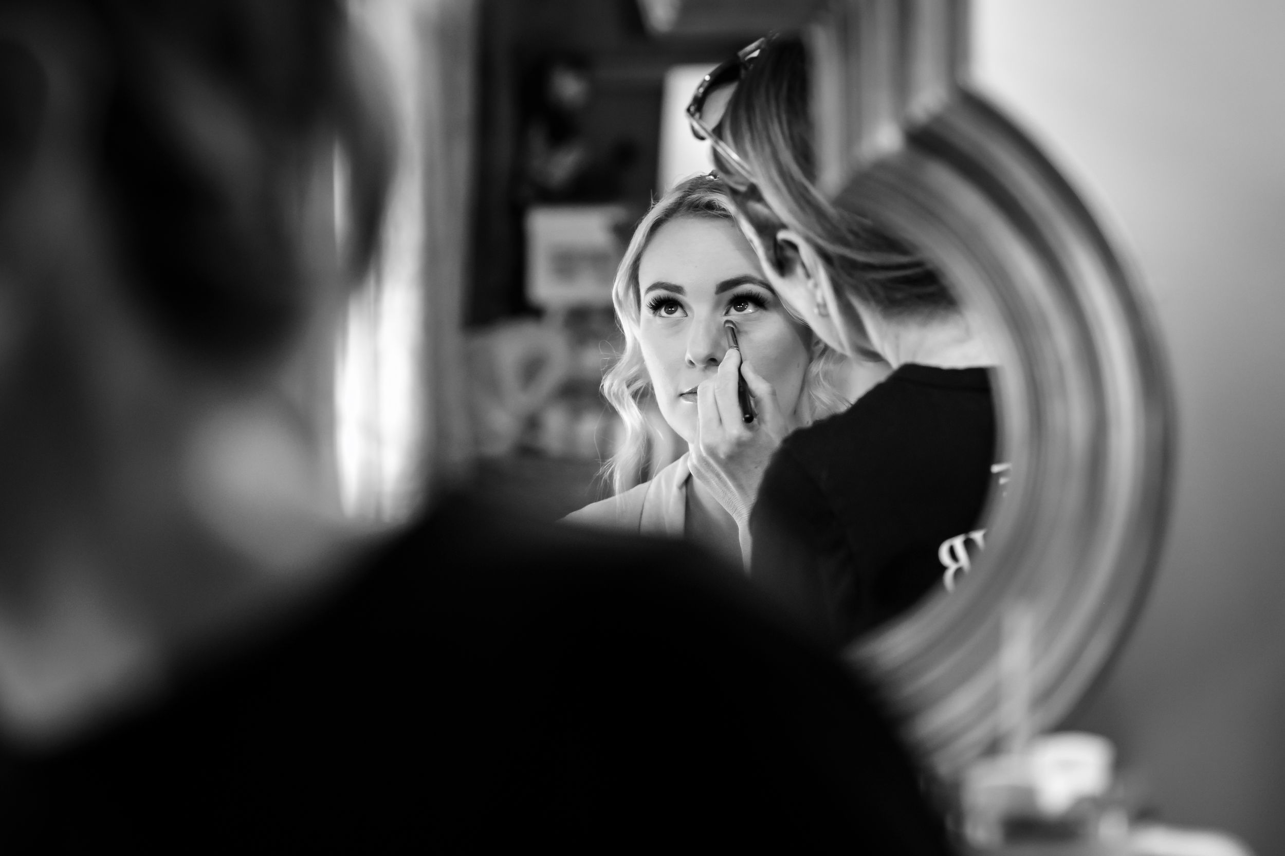 Artistic black and white portrait with circular bokeh effects.