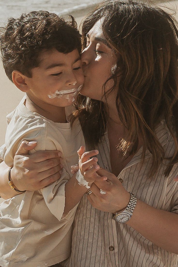 A tender moment shared between parent and child in warm natural lighting.