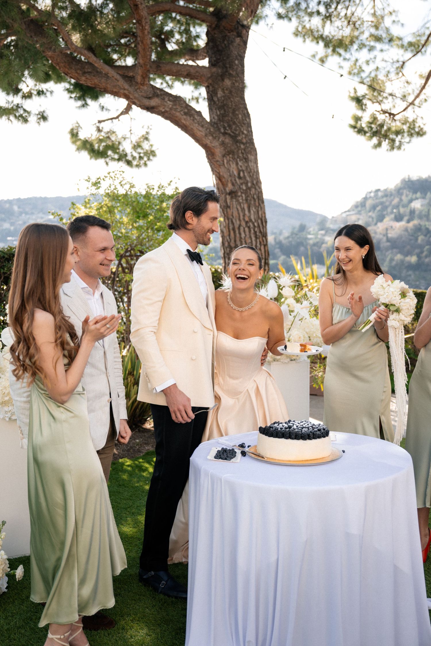 A romantic proposal moment overlooking a coastal mountain landscape with misty views of the Mediterranean Sea below.