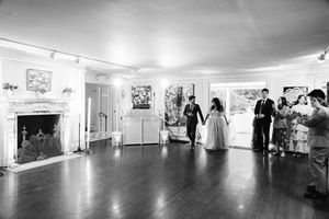 Black and white panoramic collage shows multiple hallways and rooms inside a modern gallery or exhibition space.