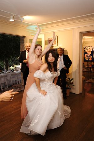 Wedding reception dance moments captured in a sequence of candid photos on a hardwood floor with warm lighting.
