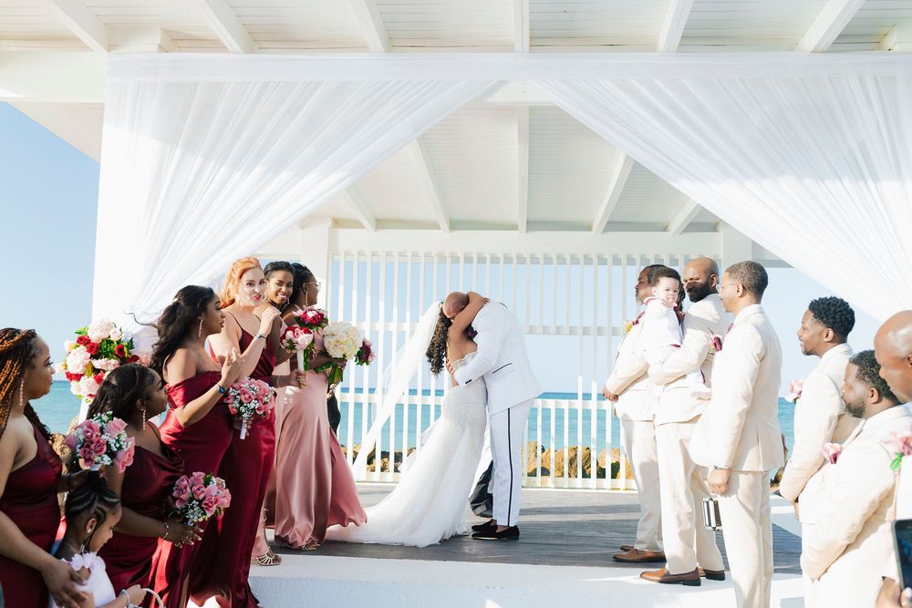 Couple exchanging vows during a luxury destination wedding at Royalton Blue Waters in Montego Bay, Jamaica