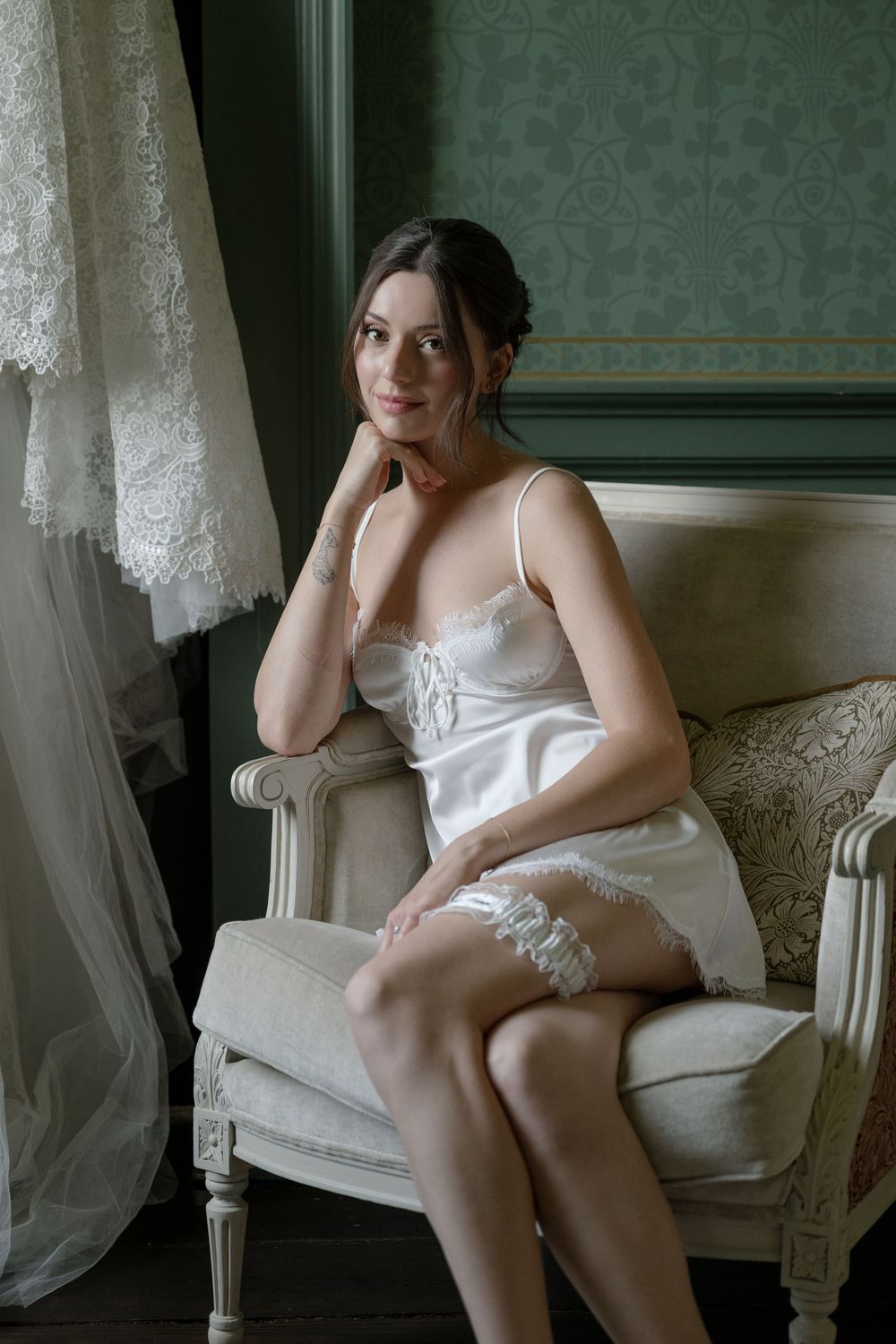 Bridal boudoir shoot featuring intimate moments in a classic setting.