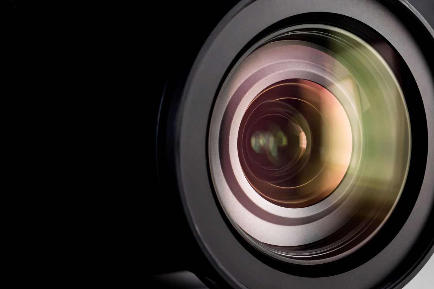 Close-up macro shots of camera lens elements showing circular glass patterns and reflective surfaces.