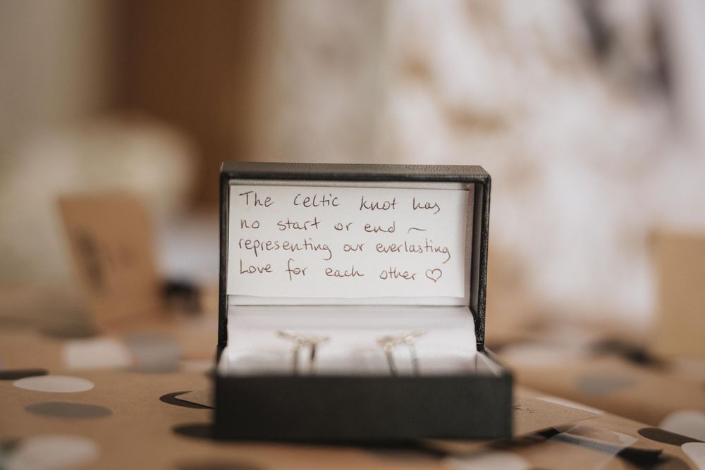 A series of handwritten notes on small index cards arranged in a row with soft blurry background.