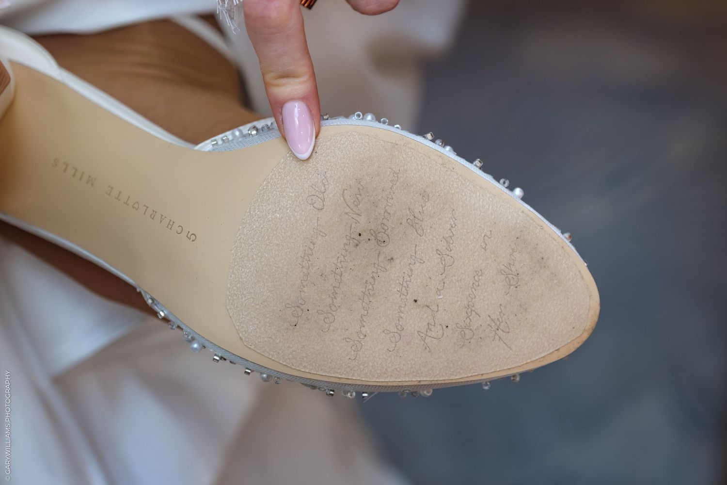 A close up view of boots and shoes showing repair and refinishing techniques for leather footwear.