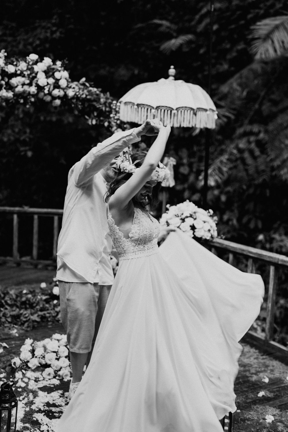 Wedding photography sequence showing romantic moments with white floral decorations.