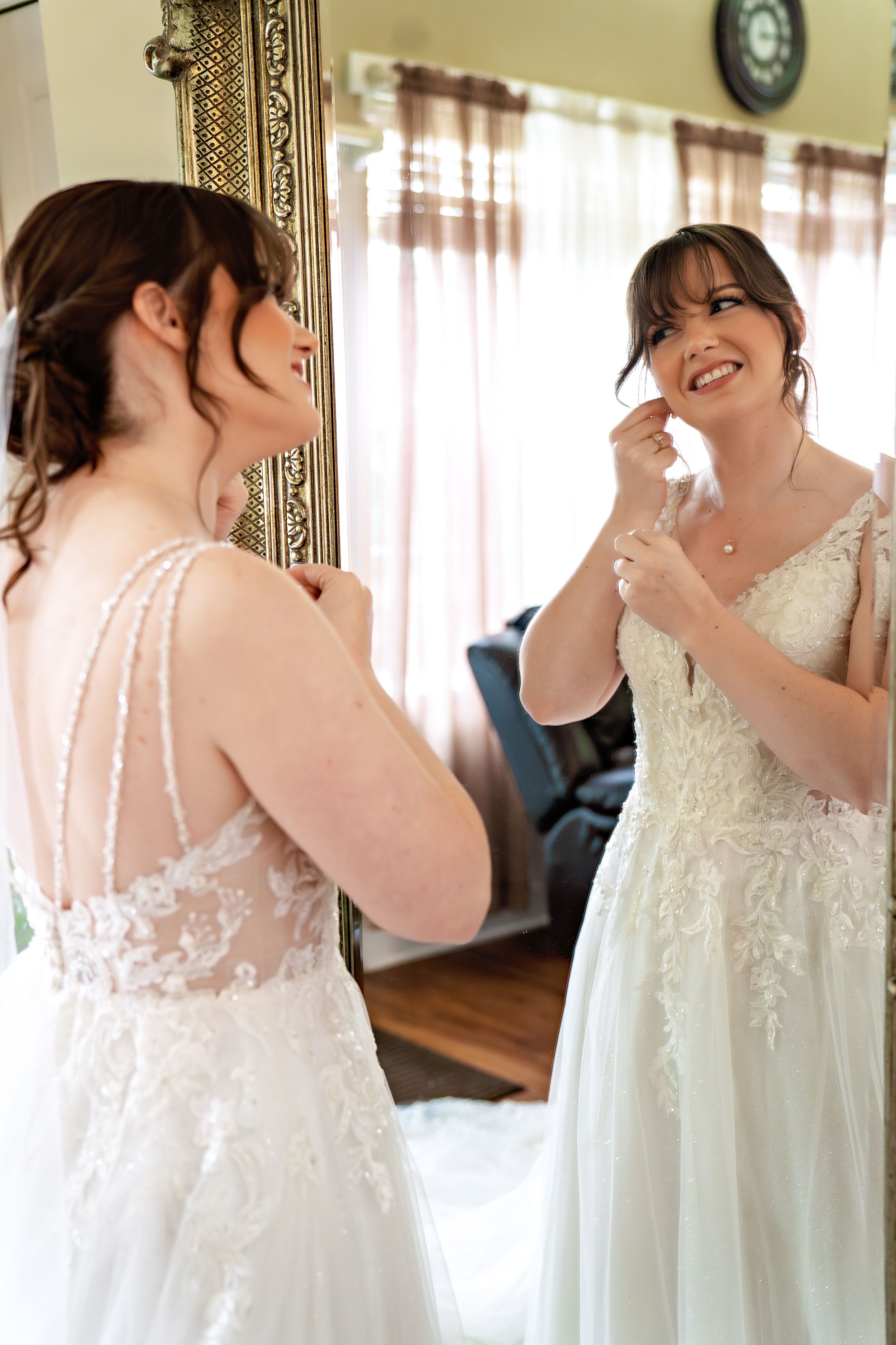 A sequence of eight shots showing the side and back details of a white lace wedding dress with pearl buttons.