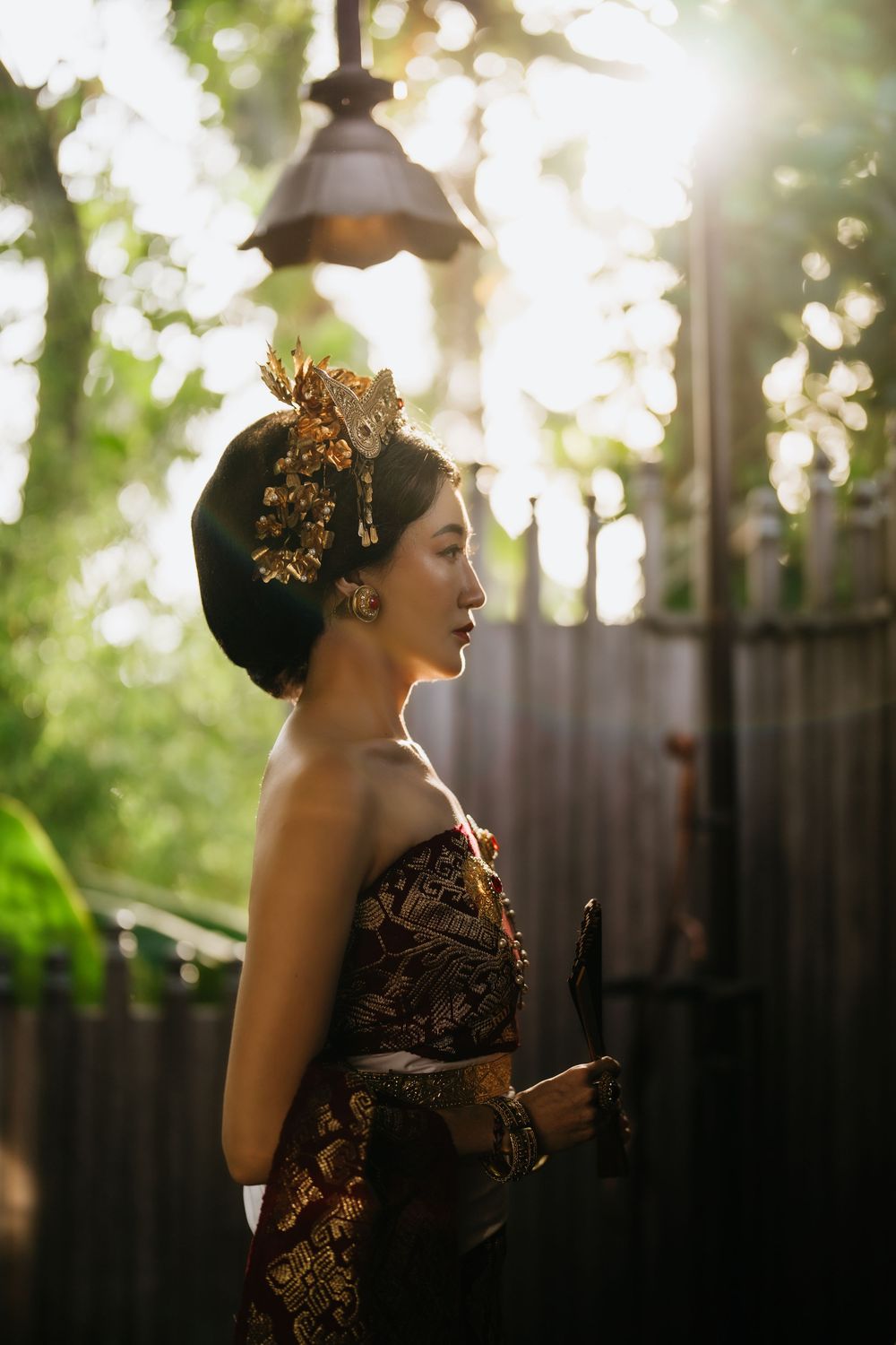 Traditional Balinese fashion photoshoot in golden afternoon light.