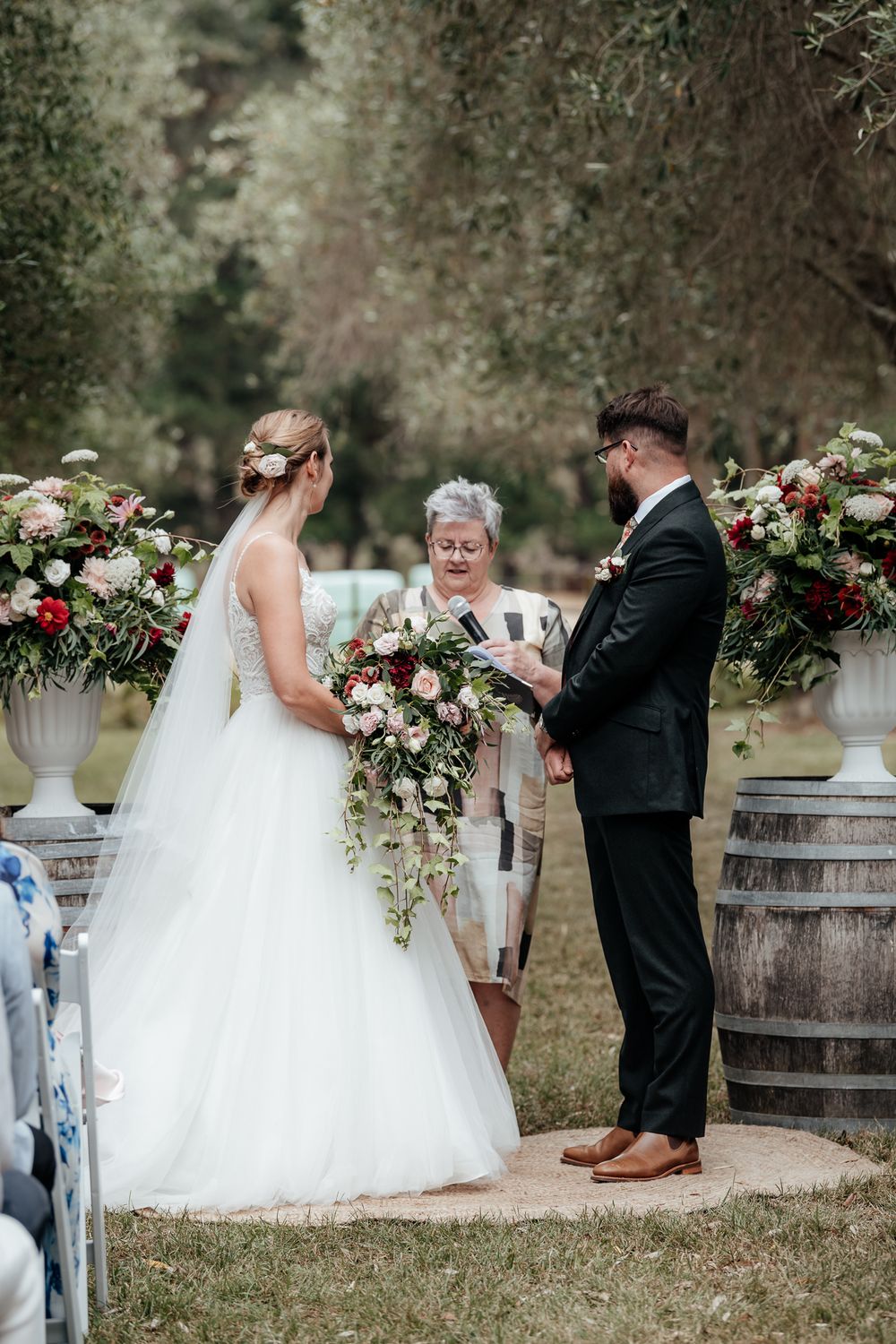 Bride and groom and celebrant during ceremony at Tironui Farm Martinborough by August and Vine