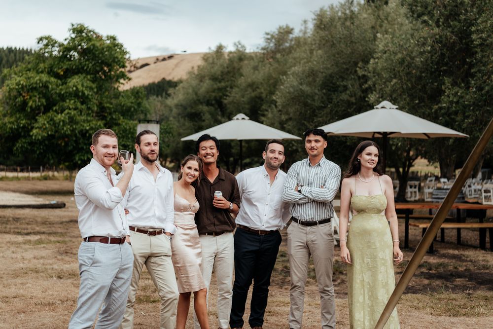 Wedding guests mingle outside at Tironui Farm Martinborough by August and Vine