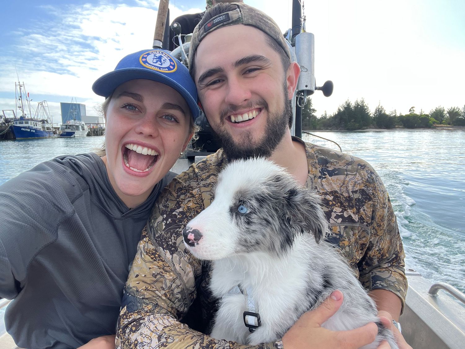 Joyful moments captured on a boat with a fluffy white dog.