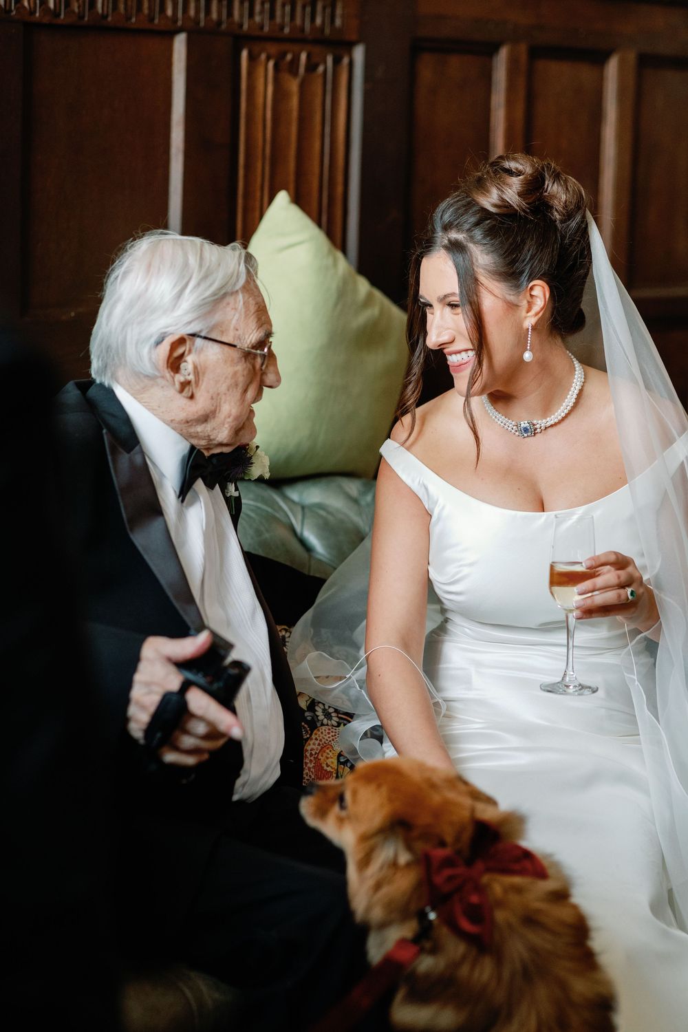 A series of candid wedding photos showing a bride in white dress with a dog in warm lighting.