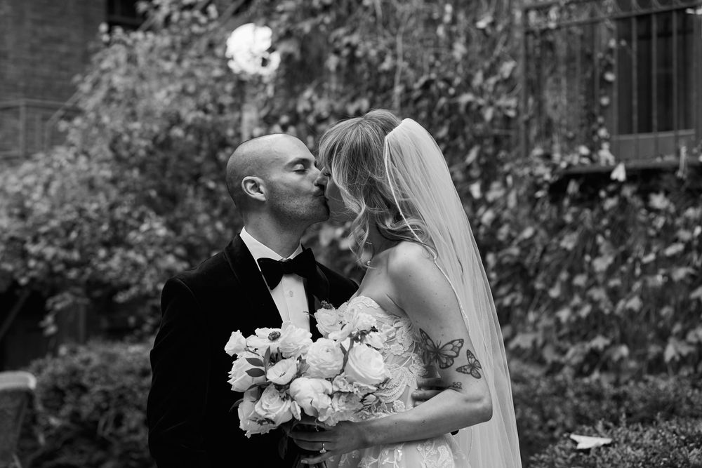 Black and white wedding photography sequence capturing intimate moments between the bride and groom outdoors.