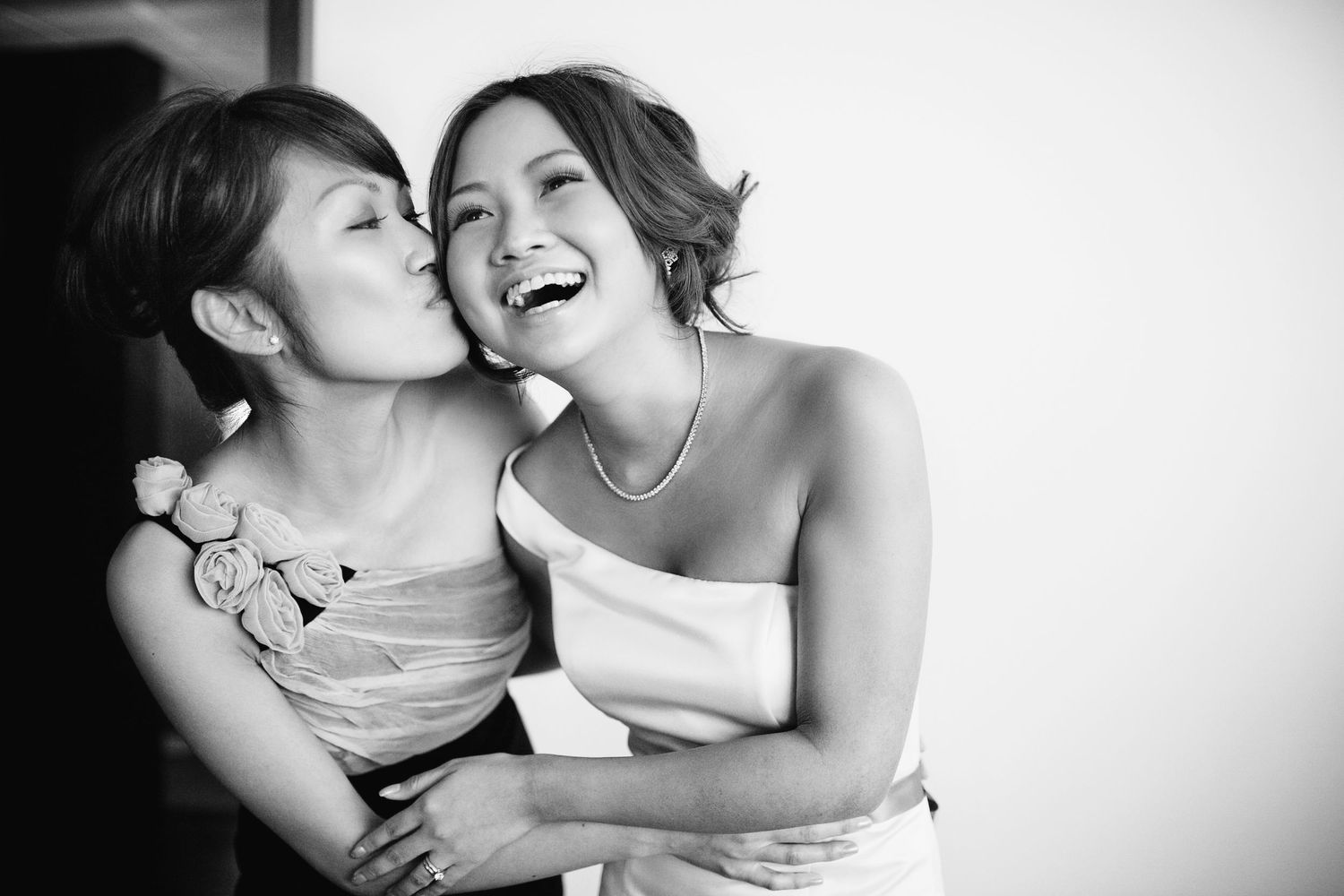 cute moment between bride and bridesmaid at wedding in Shanghai, China