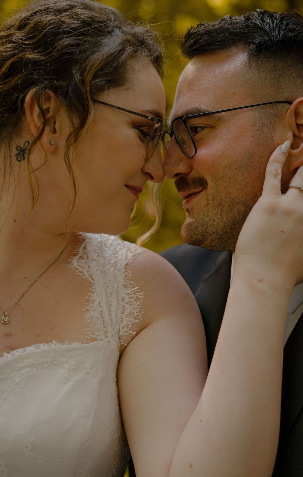 A romantic wedding photo series showing intimate close-up moments between a couple in warm golden lighting.