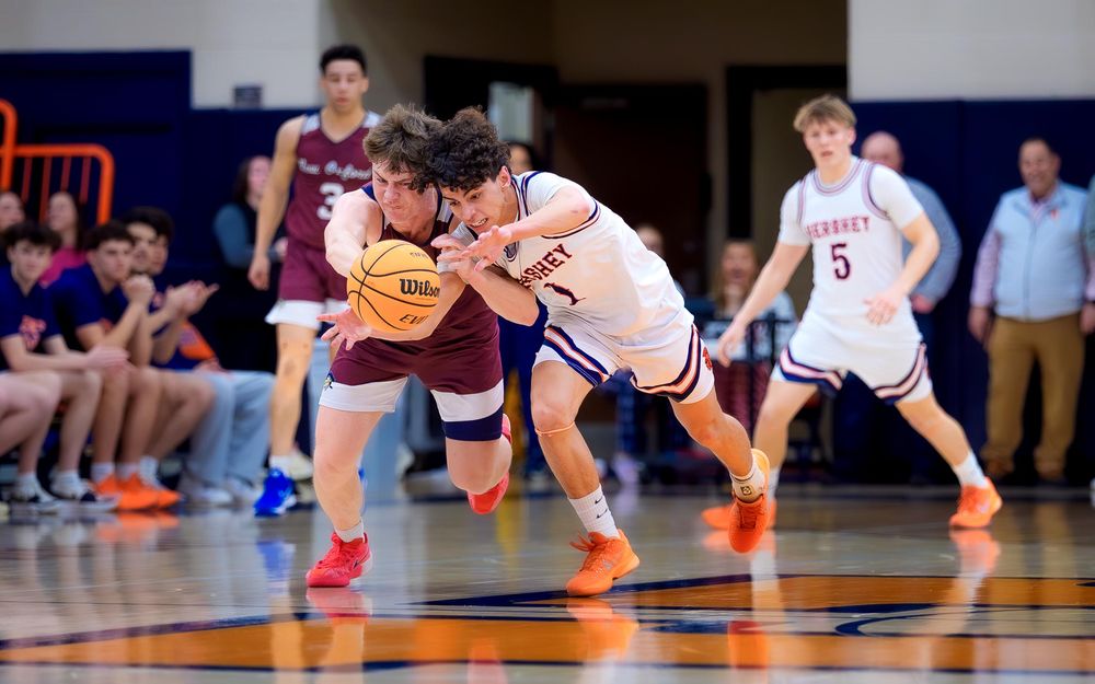 Trojans player steals the ball from New Oxford driving toward the basket during the quarterfinals by SportsFox Photography, Hershey PA.