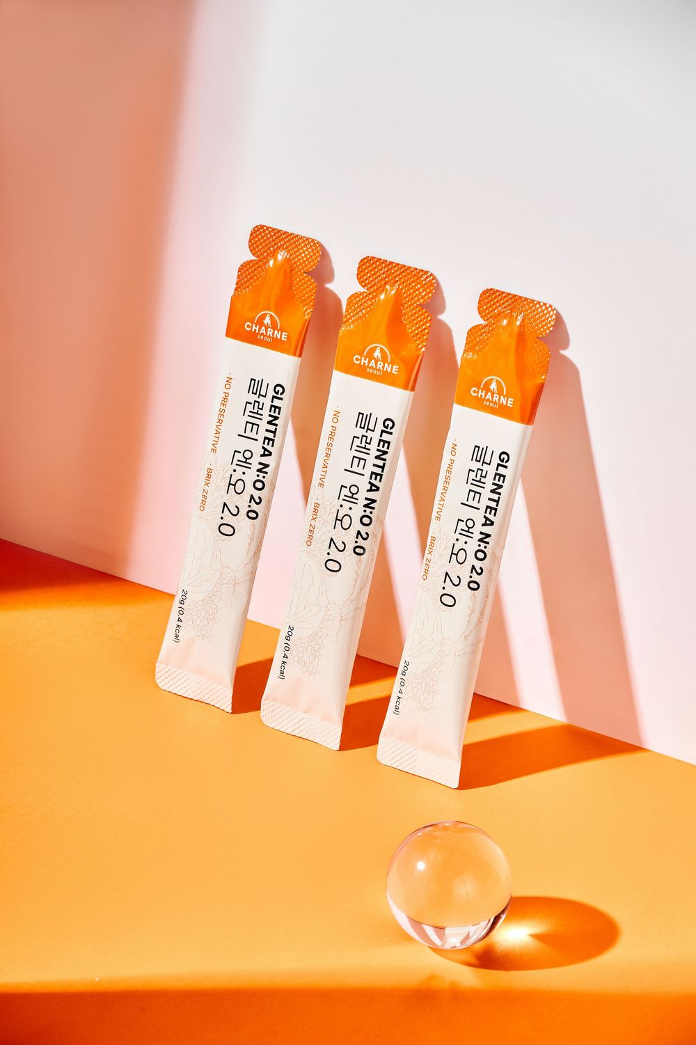 Chụp ảnh thực phẩm bổ sung collagen nền cam cùng nguyên liệu tự nhiên